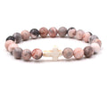Pulsera de cruz con cuentas de moda